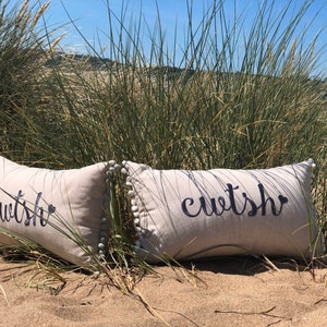 Cwtsh cushion (welsh cwtch)  linen embroidered with pom-poms (sold individually)
