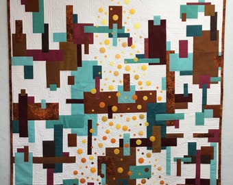 Abstract geometric art quilt in teals, browns and yellows