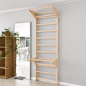 May include: A light-colored wooden wall-mounted exercise ladder featuring a vertical frame with multiple horizontal rungs, a top pull-up bar section with side supports, and a lower detachable horizontal bar assembly with matching side brackets.