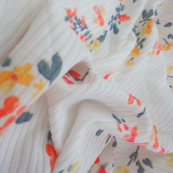 Ribbed Yummy 4x2 Floral Print Apparel material fabric Beautiful spring colors, peach yellow and sage soft 4 way stretch knit sewing clothes.