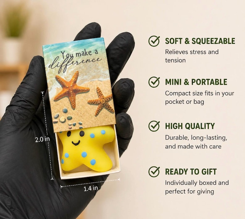 May include: A small yellow starfish-shaped stress toy with blue spots inside a cardboard box. The box lid features a beach scene with two starfish and the text 'You make a difference'. Dimensions are 2.0 inches by 1.4 inches as indicated on the image.