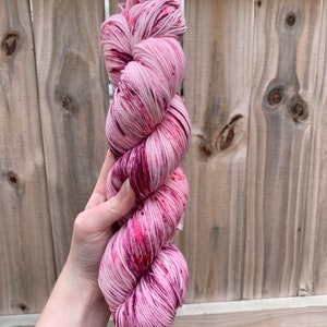 Knockout | Hand dyed yarn | Ready to Ship | pink yarn with pink, vermillion, and burgundy speckles