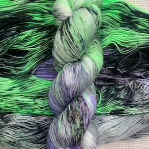 A Graveyard Smash | Hand dyed yarn | Green, gray, purple yarn with black speckles