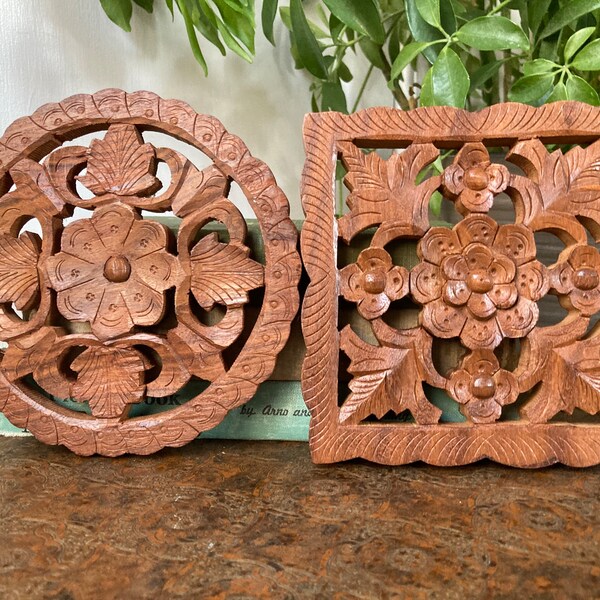 Pair of carved wood trivets