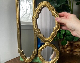 Gold Art Deco plastic mirrors