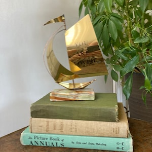 Brass sailboat onyx base
