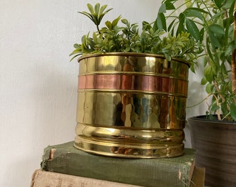 Brass planter with copper stripe