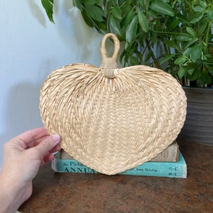 Palm leaf heart shaped fan