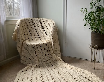 Cream colored crocheted afghan