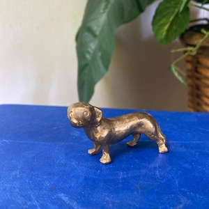 Tiny brass dachshund