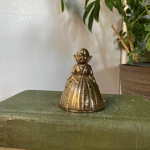 Brass girl bell