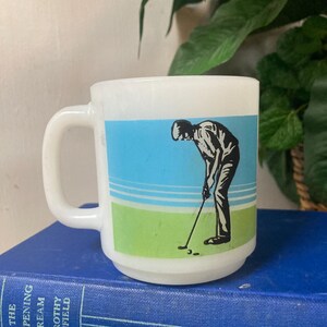 Milk glass golfing mug