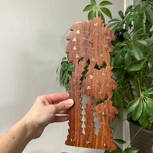 Wood and brass palm tree hook