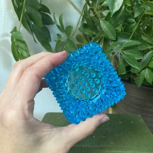 Blue glass hobnail candle holder
