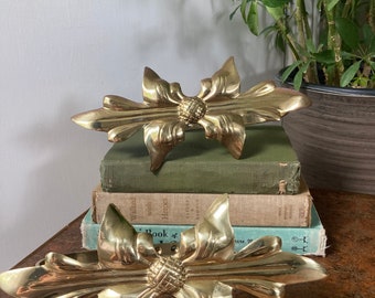 Ornate brass curtain holds