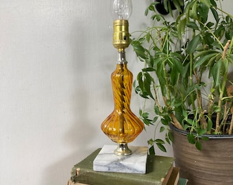 Amber glass lamp on marble base