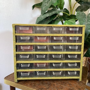 Green fabric covered plastic storage bin.  C