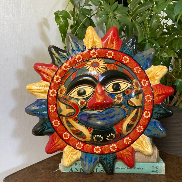 Sun face painted terra cotta wall hanging