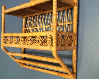 Vintage bohemian rattan and wicker shelf with towel holder
