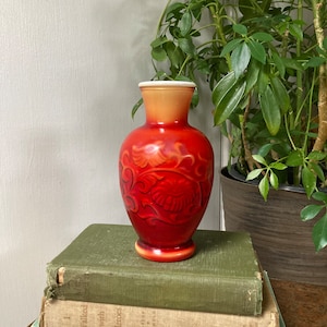 Red coated ceramic vase.  B