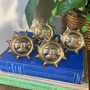 Brass sun face napkin rings