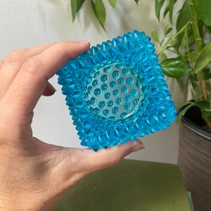 Blue glass hobnail candle holder