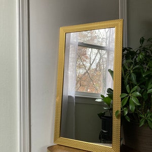 Gold woven design plastic mirror