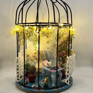 Α cozy corner in a gazebo doll house miniature, metal-wood room diorama.