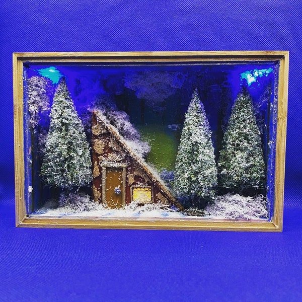 Eine Hütte tief im verschneiten Wald Diorama, hölzerne Schattenbox