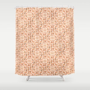 May include: A shower curtain with a repeating pattern of peach and brown geometric shapes. The pattern is reminiscent of traditional tile work.
