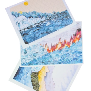 May include: Three watercolour paintings depicting abstract landscapes with blue, yellow, orange, and red colours. The paintings are stacked on top of each other.