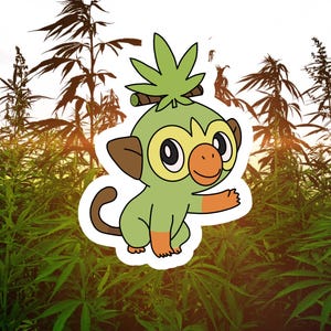 May include: A cartoon monkey character with green and brown coloring, featuring a leaf-like design on its head and orange accents. The monkey is set against a backdrop of green cannabis plants and a bright sky.