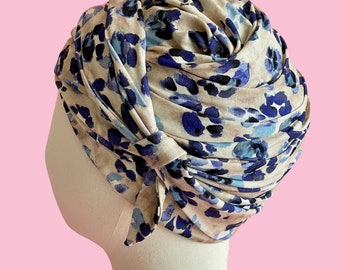 Draped cap turban in blue panther print jersey