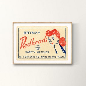 May include: Vintage matchbox label with a redheaded woman illustration. The label reads "Brymay Redheads Safety Matches Av. Contents 50 Made in Australia".