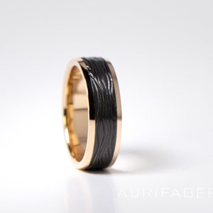 Gold ring with textured zirconium. 7mm wide. Black zirconium detail in top of gold ring. Yellow gold or white gold