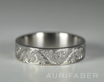 Hand engraved titanium ring. Handmade titanium scroll ring with hand engraved ornament. Nature inspired scroll design ornament.