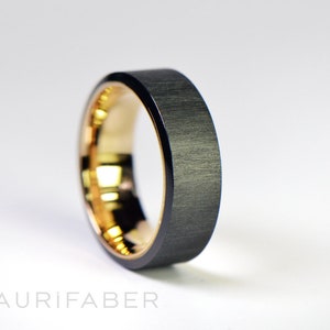Wide zirconium ring with gold inside. Black zirconium band with yellow gold, rosé gold or white gold. Two-tone band. 7mm wide.