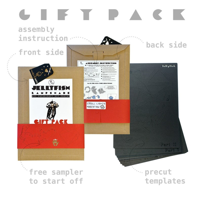 May include: A brown cardboard box with a red and white label that says "Jellyfish Lampshade DIY Papercraft Kit Precut" and "Gift Pack". The box contains instructions and precut templates for building a jellyfish lampshade. The templates are black and are stacked on top of each other.