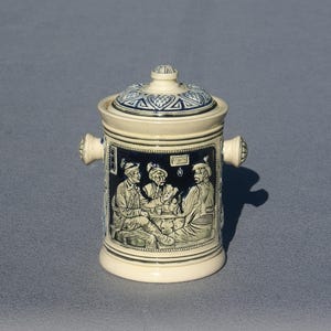 Vintage ceramic tobacco pot German pottery tobacco jar with lid and handles old stoneware container with relief life scenery