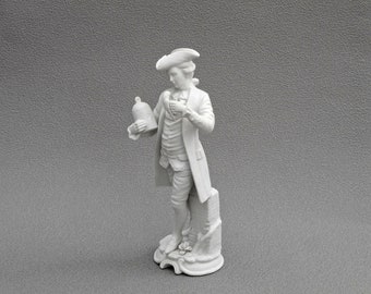 Vintage Bisque Figurine: Man with Parrot, White Ceramic Sculpture