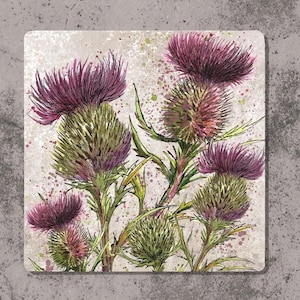 May include: A close-up of a watercolour painting of a cluster of purple thistle flowers with green stems and leaves on a white background with pink and brown splatters.