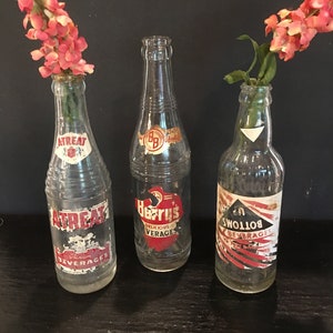 Old clear glass soda bottles,set of 3,red white label,A-Treat,Berry&#39;s,Bottoms Up,1920s,ornate,beverages,collectible,8” tall,decorative
