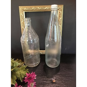 Old glass soda bottles,clear,set of 2,decorative,early 1900s,ornate,beverages,collectible,9-11&quot; tall,embossed,foggy,Dad&#39;s Root beer,