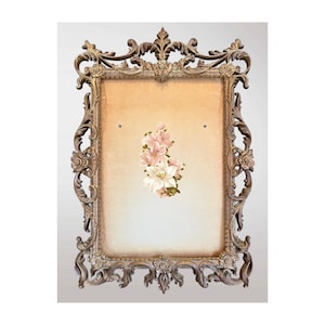 May include: Ornate, antique-style picture frame with a detailed, scrolling design in a bronze finish. The frame surrounds a beige background with a floral arrangement of pink and white flowers. Decorative and elegant.