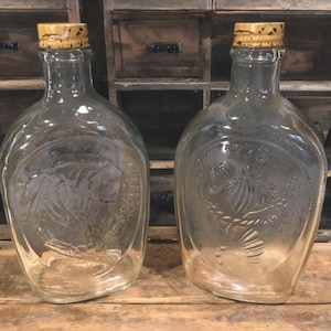 Glass log cabin syrup bottles,1776,set of 2,old clear syrup bottles,cork look lids,different design,kitchen bottles,americana bottle