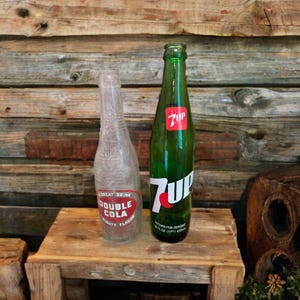 Old clear green glass soda bottles white label,set of 2,Double Cola,7 UP,1920s,beverages,collectible,10” tall,duraglas,foggy,flower vase