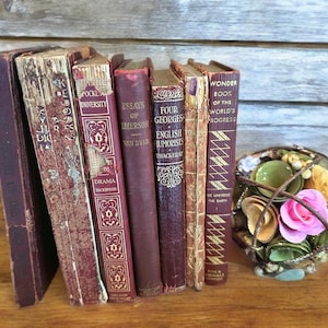 Antique small red burgundy books,gold lettering,book decor,early 1900s,set of 7,Emerson,Hugo,Dickens,literature,shades of red,bundle,worn