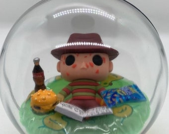 A Nightmare or Elm Street Freddy Krueger Chilling in the Pool Ornament