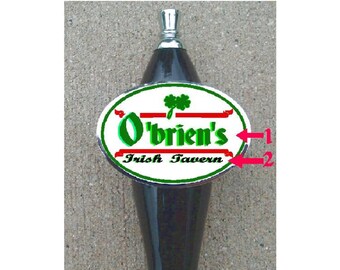 May include: A black and silver beer tap handle with a white oval sticker that says "O'Brien's Irish Tavern" with a green shamrock and red stripes.