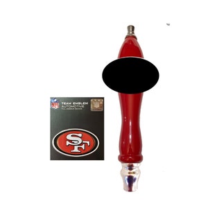 May include: Red beer tap handle with a silver top and a black oval on the front. The handle has a San Francisco 49ers logo sticker on the side. The sticker says "Team Emblem Automotive Full Adhesive Backing".